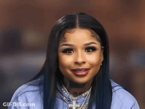 Woman In Blue Shirt With Cross Necklace GIF