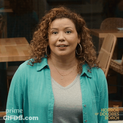 Woman In Blue Shirt With Horror Of Dolores Roach GIF