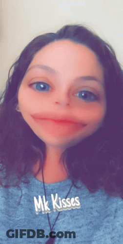 Woman In Blue Shirt With MK Kisses GIF