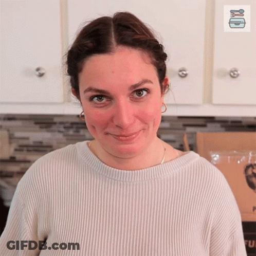 Woman In Blue Shirt With Name Tag GIF