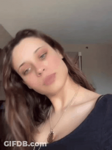 Woman In Blue Shirt With Necklace GIF