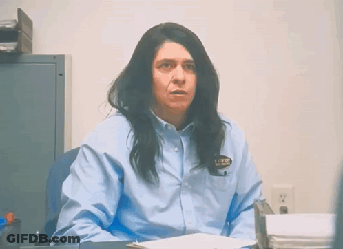 Woman In Blue Shirt With Prison Badge GIF
