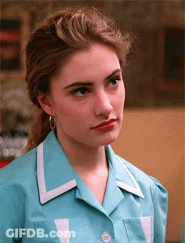 Woman In Blue Shirt With White Trim GIF