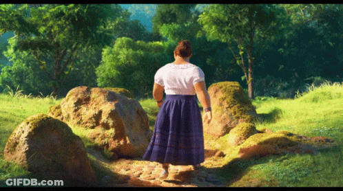 Woman In Blue Skirt Walking Through Grassy Field GIF