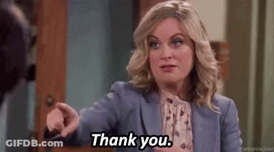Woman In Blue Suit Pointing Saying Thank You GIF
