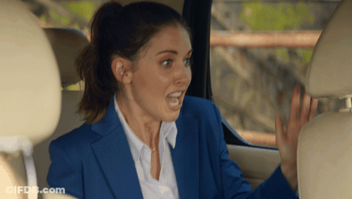 Woman In Blue Suit Sitting In Car GIF