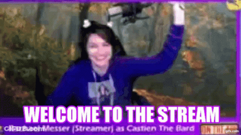 Woman In Blue Sweater In Front Of Welcome To The Stream Sign GIF