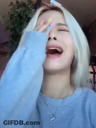 Woman In Blue Sweater Laughing Covering Face GIF
