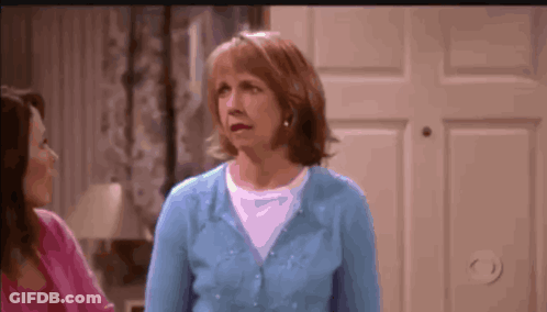 Woman In Blue Sweater Next To Woman In Pink Shirt GIF