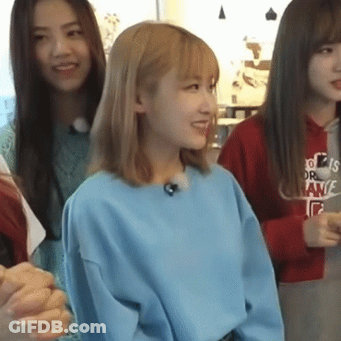 Woman In Blue Sweater Smiling With Two Women GIF
