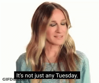 Woman In Blue Sweater Talking About Tuesday GIF