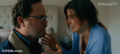 Woman In Blue Sweater Touching Man's Face Utopiatv GIF