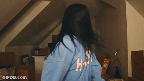 Woman In Blue Sweatshirt Saying HM GIF