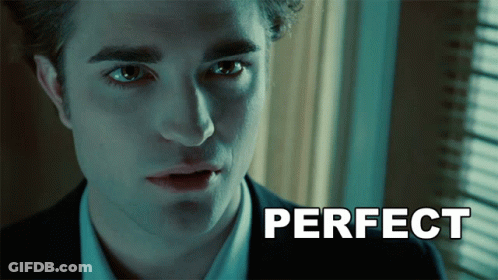 Woman In Blue Sweatshirt Smiling At Mirror GIF