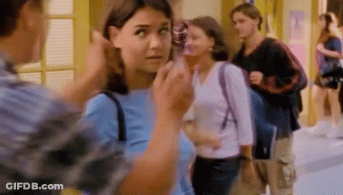 Woman In Blue Talking To Man In Plaid GIF
