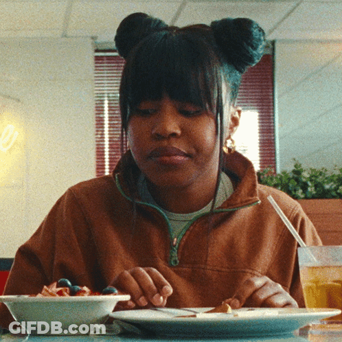 Woman In Blue Tank Top And Hoop Earrings GIF