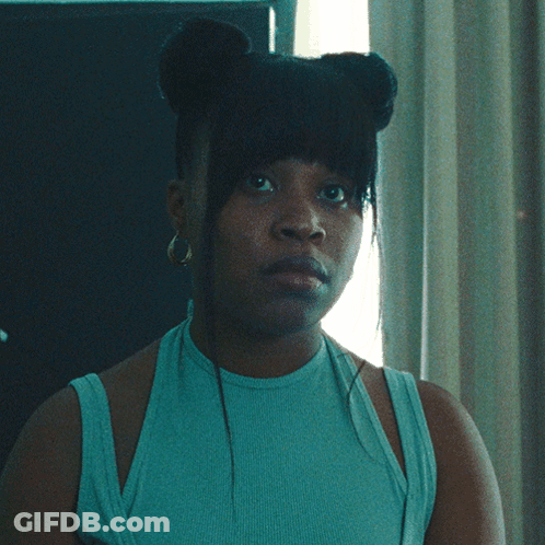 Woman In Blue Tank Top And Hoop Earrings GIF