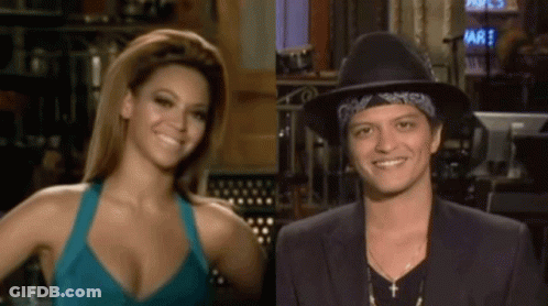 Woman In Blue Tank Top And Man In Black Hat Smiling GIF