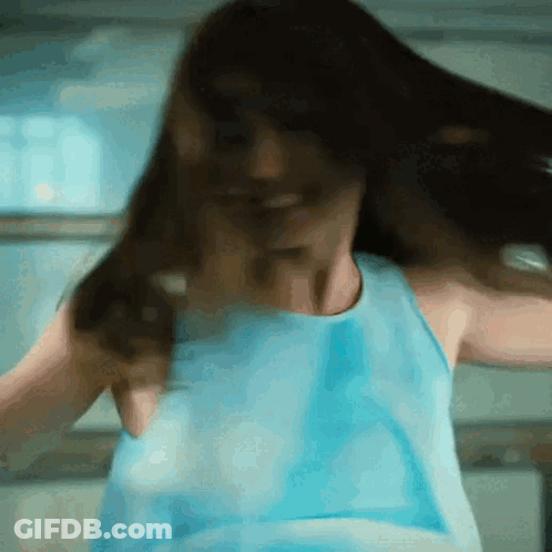 Woman In Blue Tank Top Dancing With Hair Flying GIF