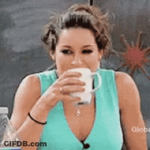 Woman In Blue Tank Top Drinking From Mug GIF