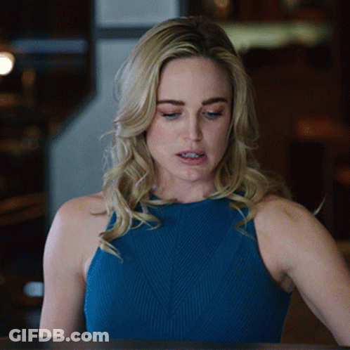 Woman In Blue Tank Top Looking Down GIF