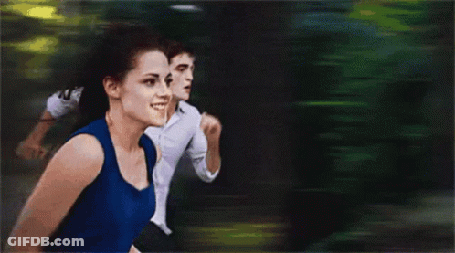 Woman In Blue Tank Top Running Beside Man In Suit GIF