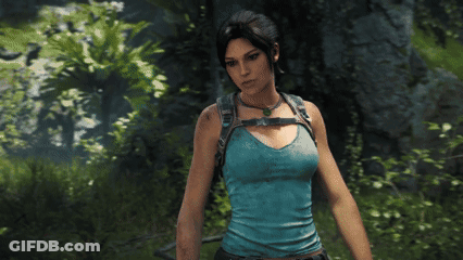 Woman In Blue Tank Top Standing In Forest GIF