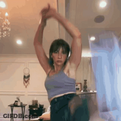 Woman In Blue Tank Top Stretching GIF