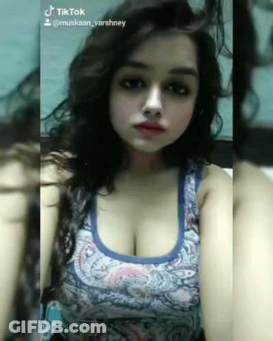 Woman In Blue Tank Top With TikTok Account GIF