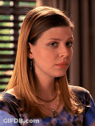 Woman In Blue Tie Dye Shirt And Necklace GIF