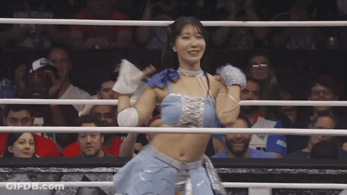 Woman In Blue Top And Silver Skirt Boxing Ring GIF