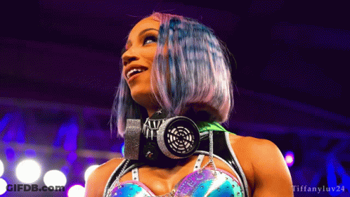Woman In Blue Top And Silver Skirt In Boxing Ring GIF