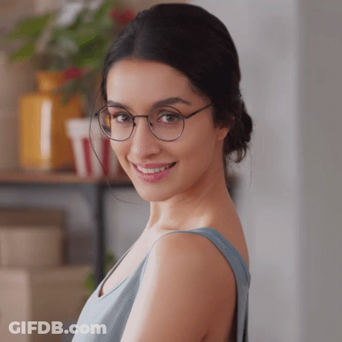 Woman In Blue Top Smiling GIF