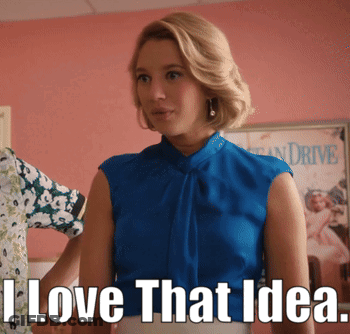Woman In Blue Top Standing In Front Of I Love That Idea Sign GIF