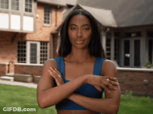 Woman In Blue Top With Arms Crossed GIF