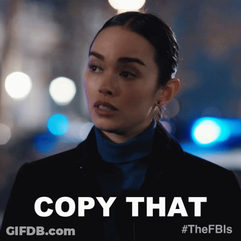 Woman In Blue Turtleneck Saying Copy That GIF