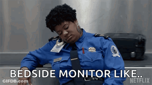 Woman In Blue Uniform Says Bedside Monitor GIF