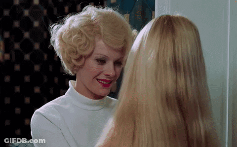 Woman In Blue Wig And Purple Gloves GIF