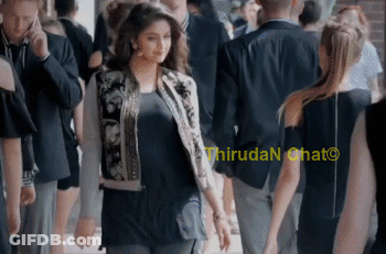 Woman In Bomber Jacket Walking Through Crowd Saying Thiruda N Chat GIF