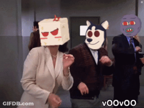 Woman In Box Dancing With Man In Dog Mask GIF