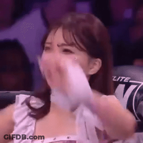Woman In Boxing Ring Covering Mouth With Towel GIF