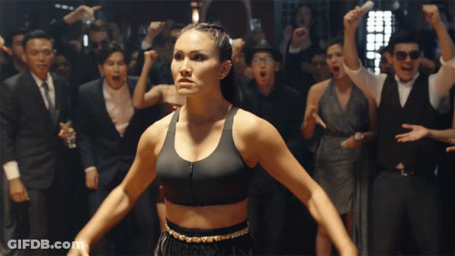 Woman In Boxing Sports Bra In Front Of Crowd GIF
