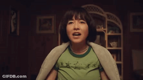 Woman In Braces And Green Star Shirt GIF