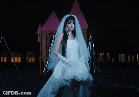Woman In Bride Dress In Front Of Fire GIF