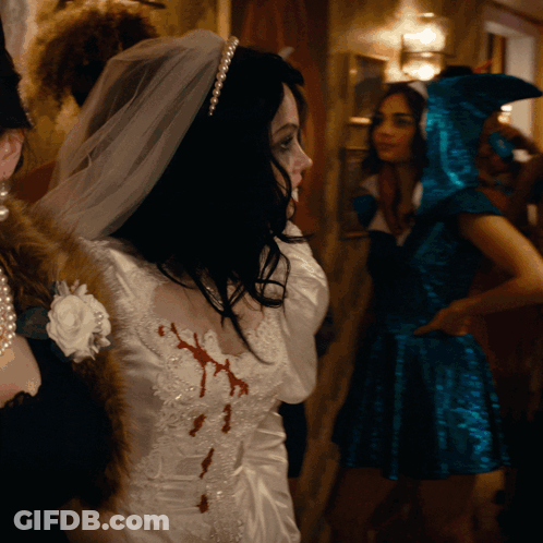 Woman In Bride Dress With Blood On Chest GIF