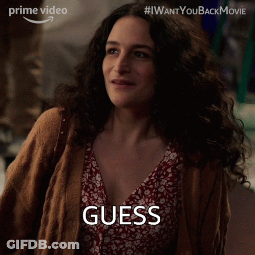 Woman In Brown Cardigan Red Floral Dress Saying Guess GIF