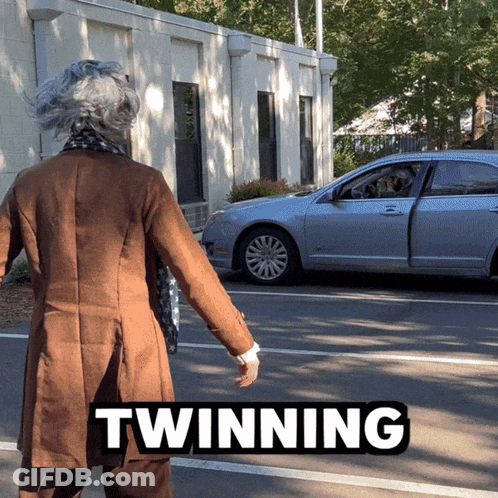 Woman In Brown Coat Walking Toward Silver Car Twinning GIF