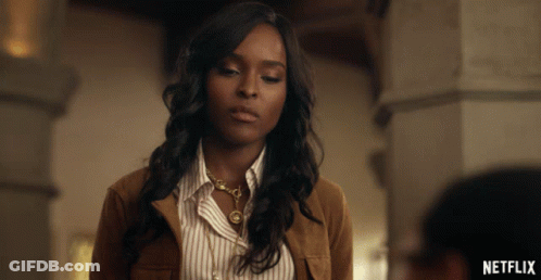 Woman In Brown Jacket And Striped Shirt Netflix Ad GIF