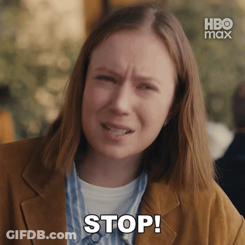 Woman In Brown Jacket Says Stop In Front Of HBO Max Logo GIF