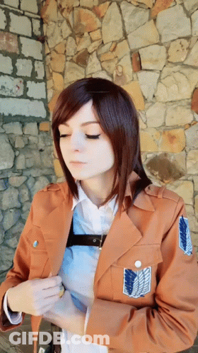Woman In Brown Jacket With Shoulder Shield GIF